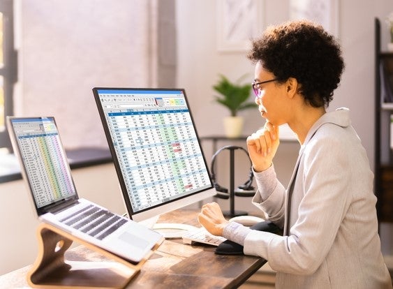 A woman looking at a computer screen