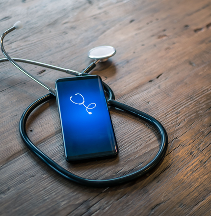 A cell phone with a stethoscope on it